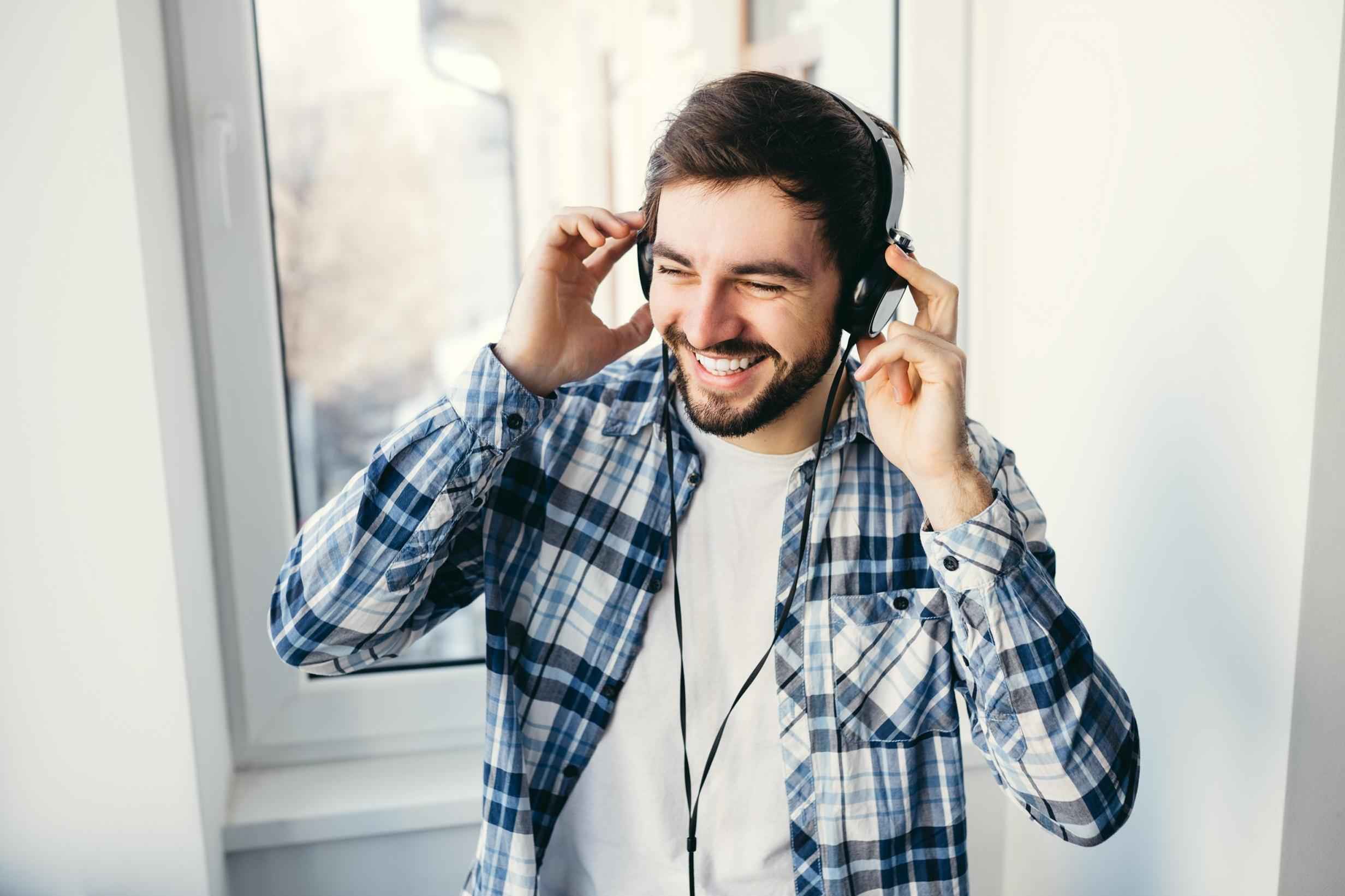 Happy man listening to music