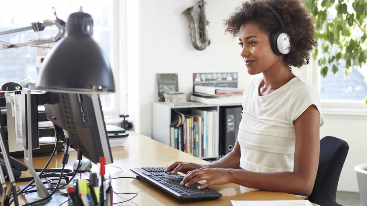 Woman studying and enjoying music