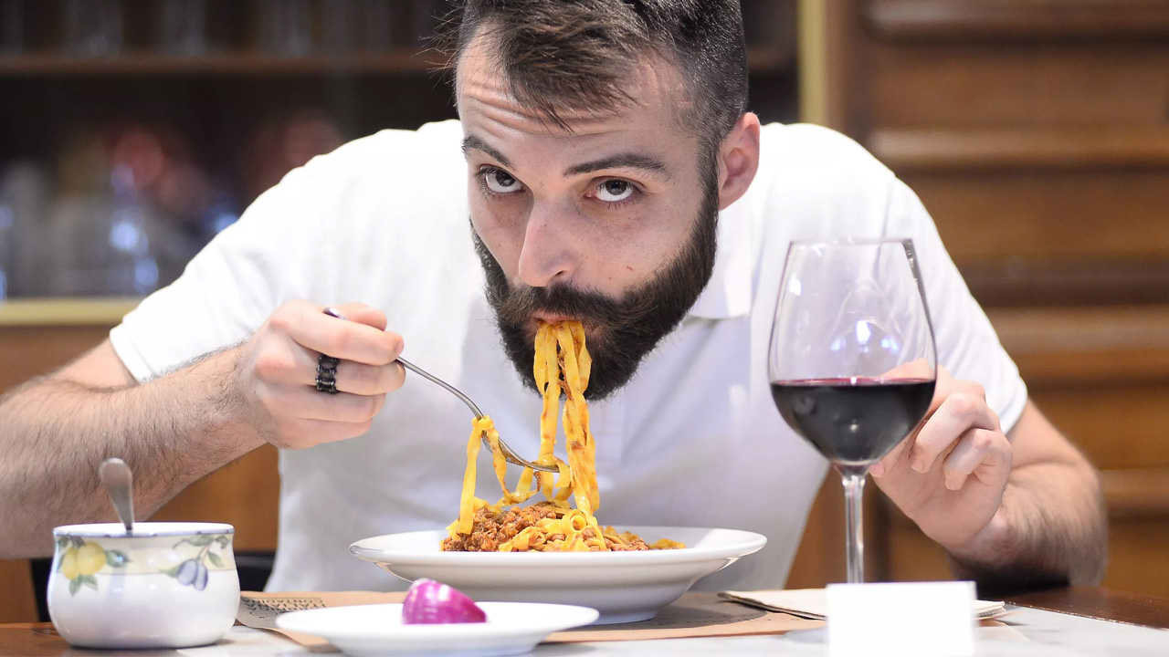Man drinking wine with food